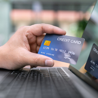person holding a credit card