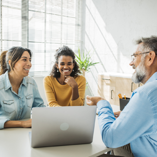 financial advisor talking to couple