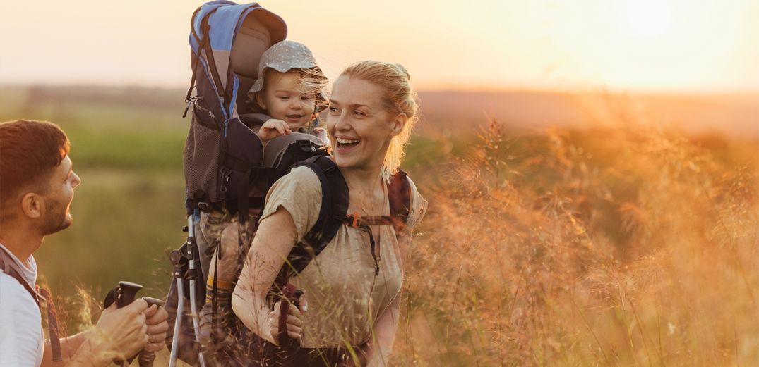 A young family takes a late afternoon hike in California.