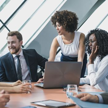 Patelco Home Loan Consultants seated around a conference table