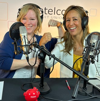 Patelco employees Michele Enriquez and Tiffany Keiffer at the podcast desk