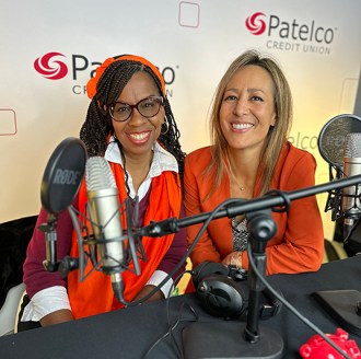 Patelco employees Michele Enriquez and Veronica Dangerfield at the podcast desk.
